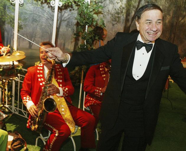 Musical composer Richard Sherman conducts the band at the after-party for Disney's "Mary Poppins"...