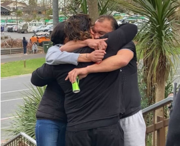 Hendrix John Kahia hugs supporters outside the High Court at Hamilton after being acquitted of...