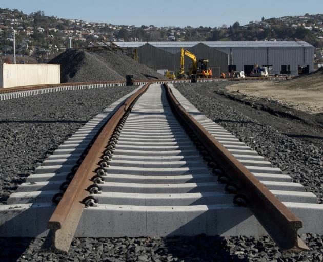 Crew lay track at the new Hillside Railway Workshops yard. PHOTO: GERARD O’BRIEN