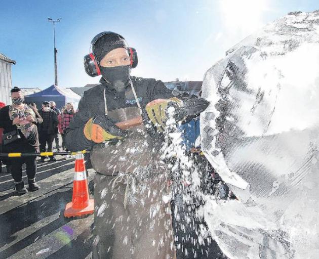 Victor Cagayat, of Auckland, in the car park at Blackwells Department store puts his ice...