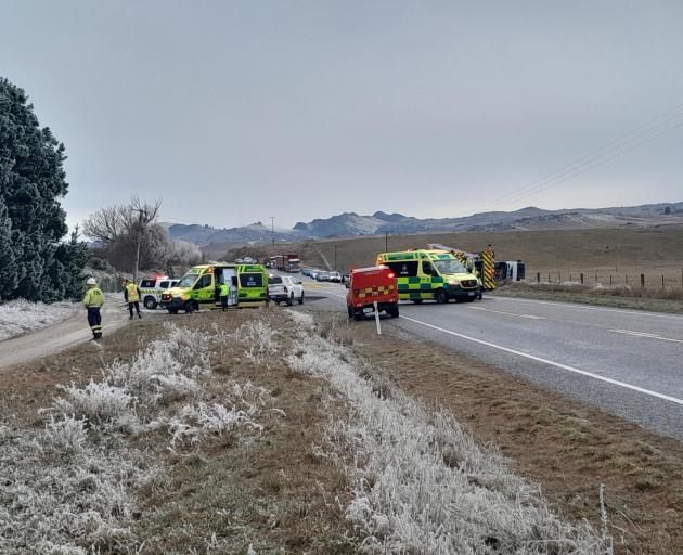 Emergency services at the scene of the crash in icy conditions on SH85 this morning. Photo: Ruby...