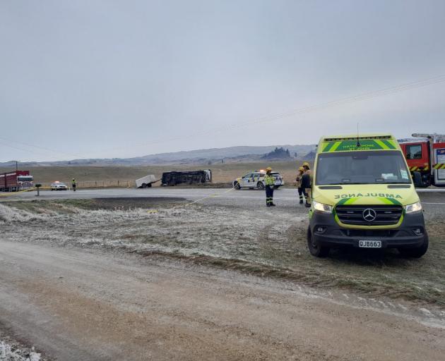 Emergency services at the scene of the bus crash near Chatto Creek this morning. Photo: Ruby Shaw 