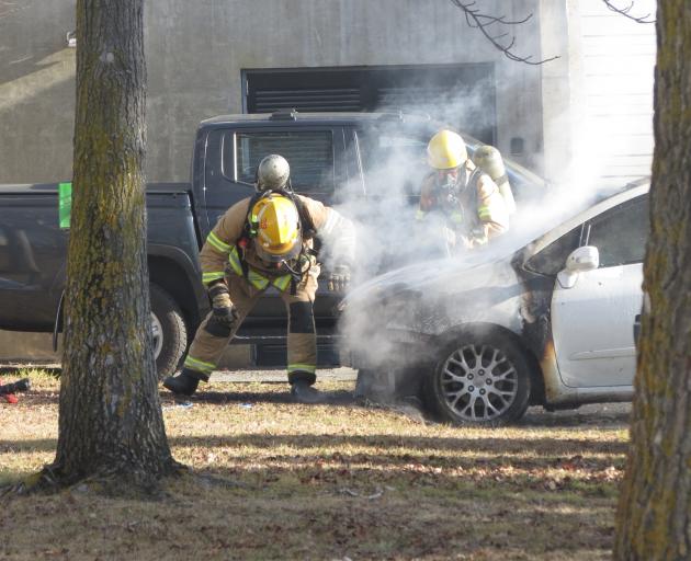 Firefighters work to extinguish the blaze. 