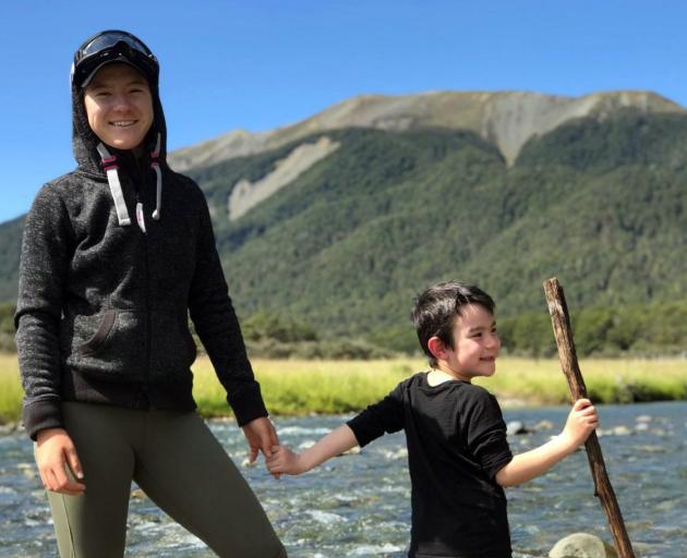 A younger Lulu Sun, pictured with her younger brother, Quintin, having fun in the wilderness of...