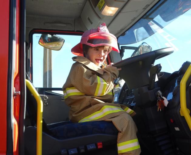 Mordecai Hawkins, 4, enjoys getting behind the wheel of a fire engine at the Glenavy Fire brigade...
