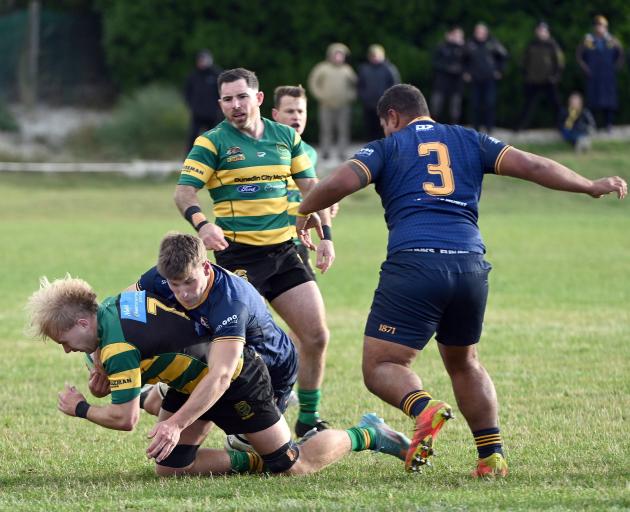 Dunedin forward James Bolton tackles Green Island loosie Amos Roddick at Kettle Park on March 30....