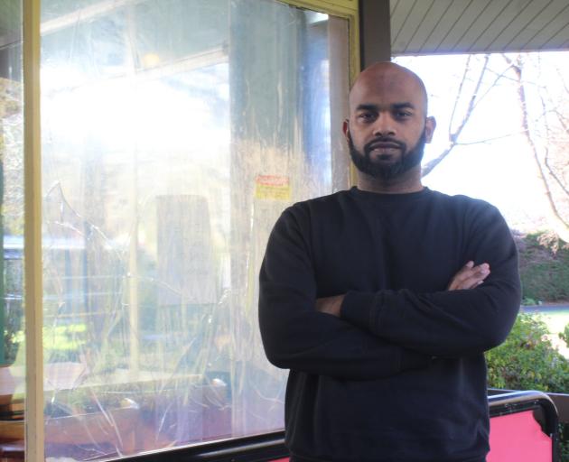 The Cheeky Llama Cafe manager Melwin Mathew is disappointed the window of the business has been...