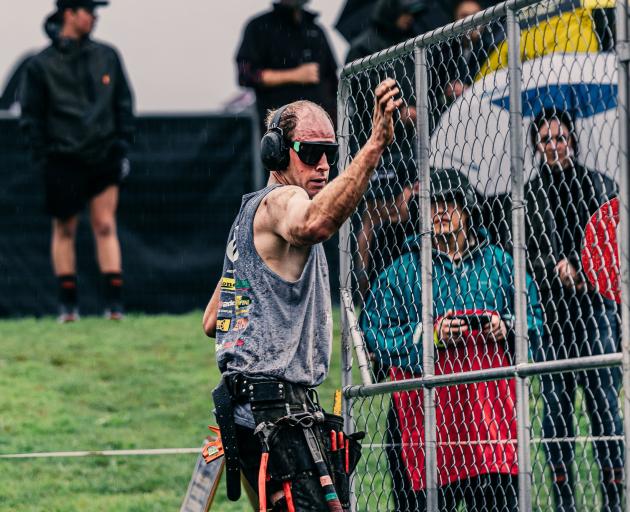 Fencer Craig Sinclair, of the Catlins, hoists a gate at the Fieldays Fencing Competition in...