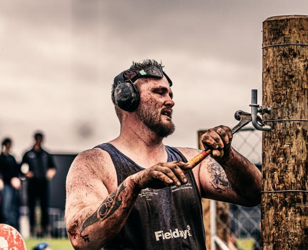 Fencer William Pei, of Balclutha, installs a gudgeon at the Fieldays Fencing Competition in...