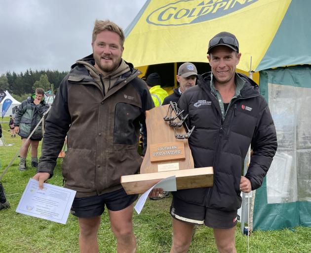 Fencers William Pei (left) and Craig Sinclair, both of South Otago, display the trophy for...