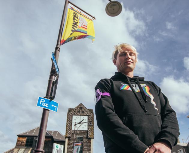 Queenstown Winter Pride co-director Sam Coulthard stands in front of a surviving Winter Pride...