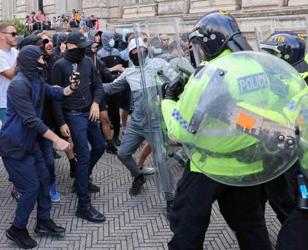 Far-right anti-immigration protesters clash with police in Liverpool. Photo: Reuters 