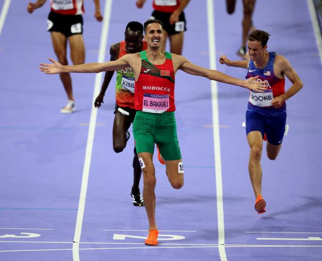 Morocco's Soufiane El Bakkali crosses the line to win gold. Photo: Reuters 