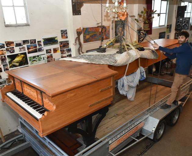 Dunedin piano maker Adrian Mann secures the world’s longest piano on a trailer in preparation for...