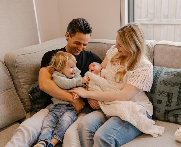 Caroline Gray and Micheal Warwick with their newborn daughter Mia and 2-year-old son Hayden....