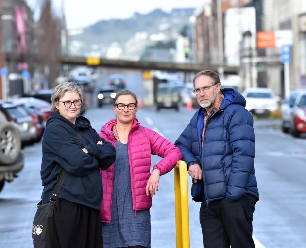 Dunedin city workers (from left) Jo Neilson, Antonia Wood and Steve Macknight discuss the removal...