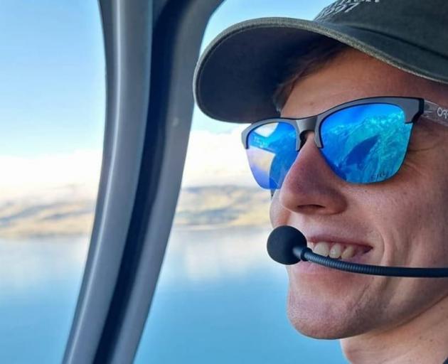 Former NZSki employee Blake Wilson flying a helicopter in New Zealand. PHOTO: SUPPLIED