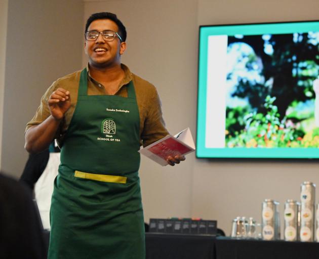 Dilmah t-Lounge sommelier Senuka Sudusinghe demonstrates pulled tea. 