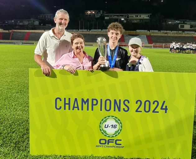 The Nelson family of Tony, Annie and Alice celebrate with Dan, a member of the All Whites under...