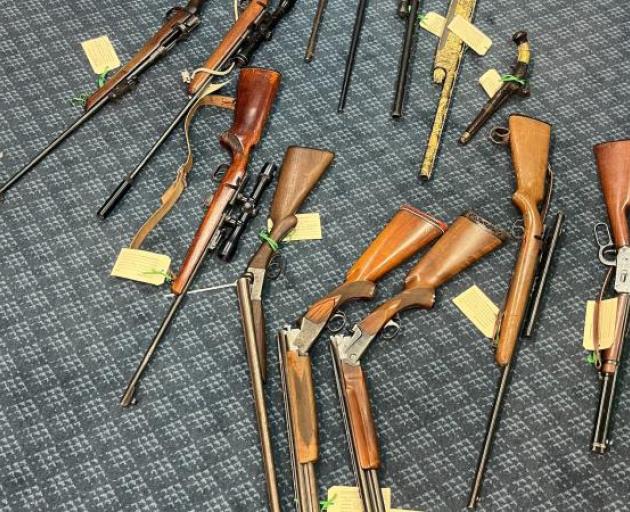 Fourteen firearms were also found in the raid. Photo: Police