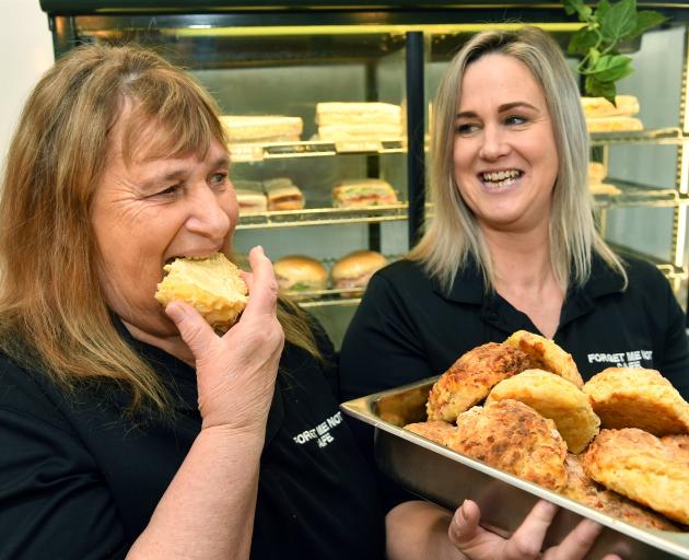 South Dunedin Forget Me Not Cafe baker Patricia Mcvicar takes a bite out of a cheese scone as...