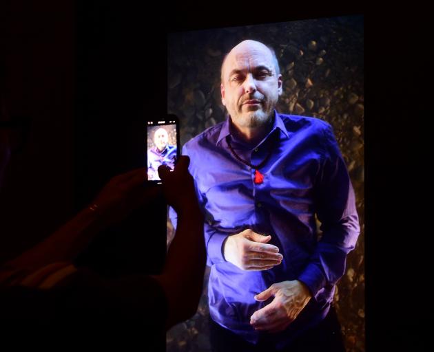 A visitor admires American artist Bill Viola's self portrait at the Artist's Selfportraits Hall...