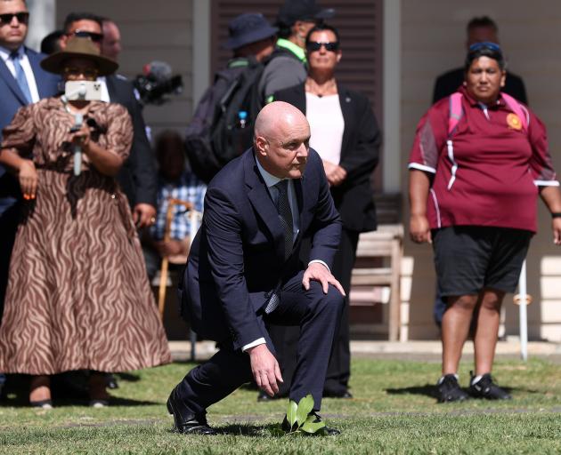 Prime Minister Christopher Luxon accepts a wero or challenge at Te Whare Runanga on Waitangi Day...