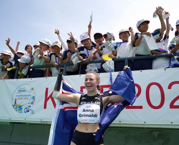 Anna Grimaldi celebrates after winning long jump silver at the world para athletics championships...