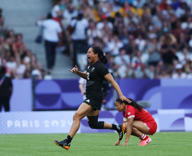 Alena Saili, of the Black Ferns, celebrates following the team's victory during the Women's Rugby...