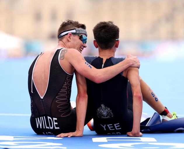 New Zealand’s Hayden Wilde (left) congratulates gold medallist Alex Yee, of Great Britain, after...