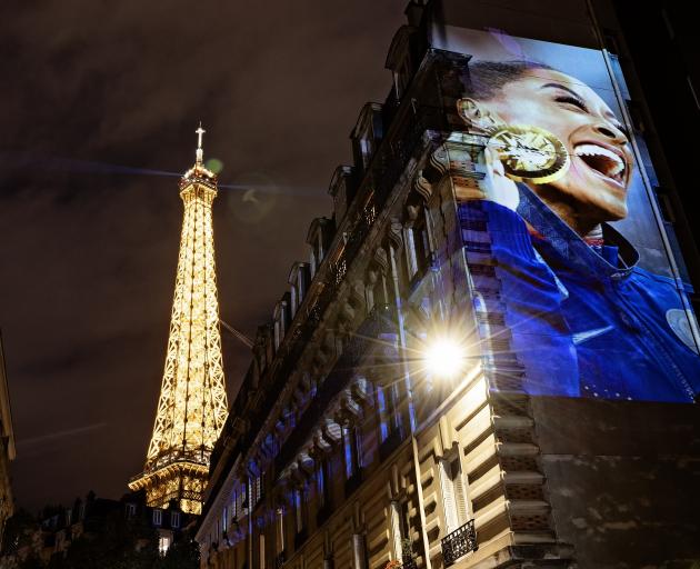 American gymnast Simone Biles’ celebration of her gold in the women’s vault is projected on the...