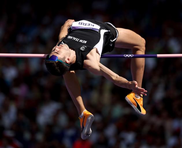 Hamish Kerr clears the bar during the high jump qualification round. Photo: Getty Images 
