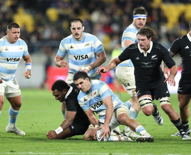 Pablo Matera of Argentina and Sevu Reece of New Zealand compete for the ball during the test...