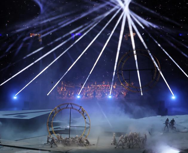 Performers assemble the Olympic Rings during the show. Photo: Getty Images 