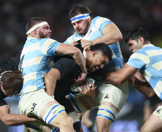 Ardie Savea of the All Blacks is tackled during tonight's test match against Argentina at Eden...