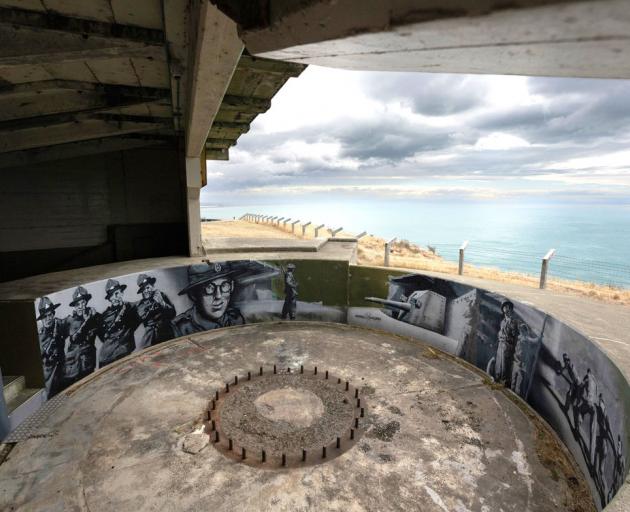 A gun emplacement and mural by Wongi Wilson at Godley Head before the restoration work. Photo: DOC