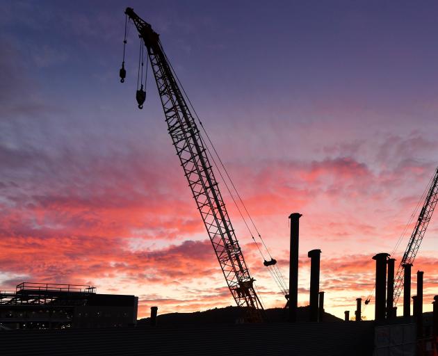 Work continues on the new Dunedin Hospital, but advice released to Health Minister Dr Shane Reti...