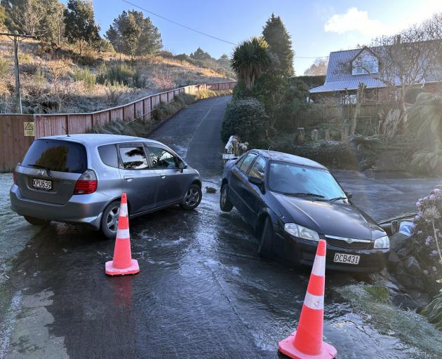 An icy start to the day on Saturday caused these cars to get stuck in Lixmont St, Kaikorai Valley...