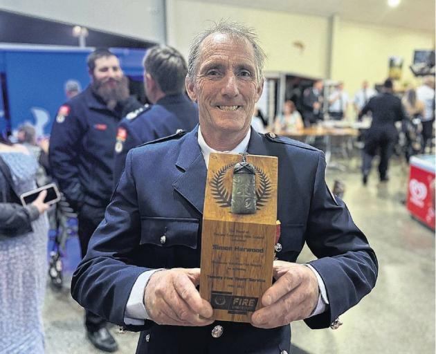 Simon Harwood from the Pendarves Volunteer Fire Brigade was awarded the Gold Star for 25 years...