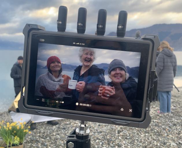 A behind-the-scenes shot of Wanaka women and regular lake dippers (from left) Nicci Huston, Lyn...