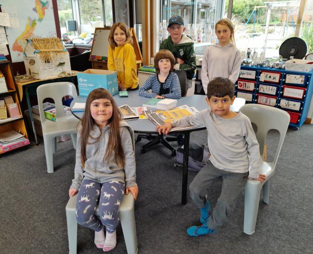 Some of the 11 pupils who go to Makarora School, at the top of Lake Wānaka, are  (front from left...