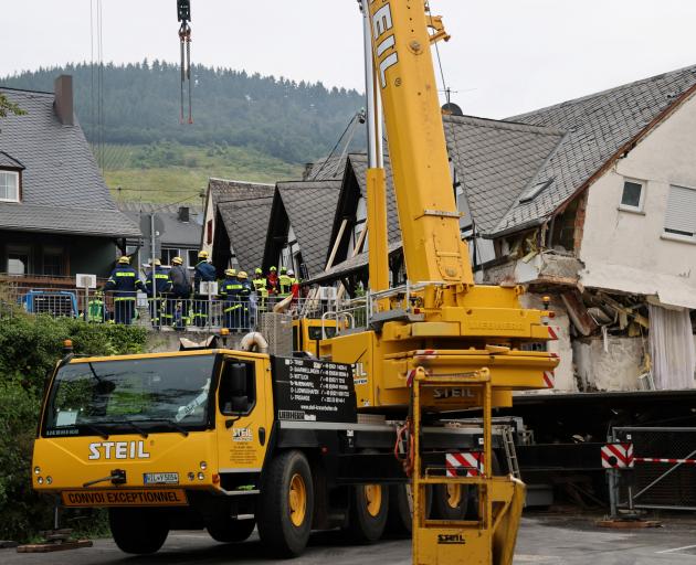 A crane is set up after the  hotel partially collapsed near the banks of Germany's river Moselle....