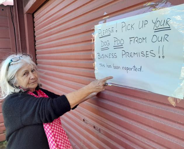 Creative Us pop-up shop occupant Colette O’Kane points to their sign warning dog owners. PHOTOS:...