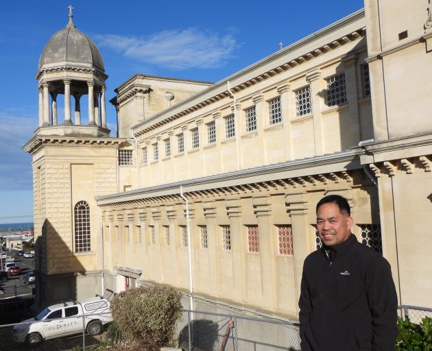 Fr Fredy Permentilla MSP alongside St Patrick's Basilica where work on a $1.4 million interior...