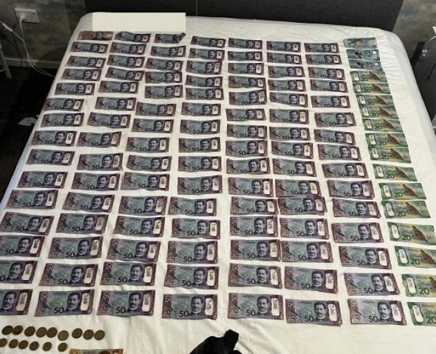 About $250,000 in cash was seized. Photo: Police