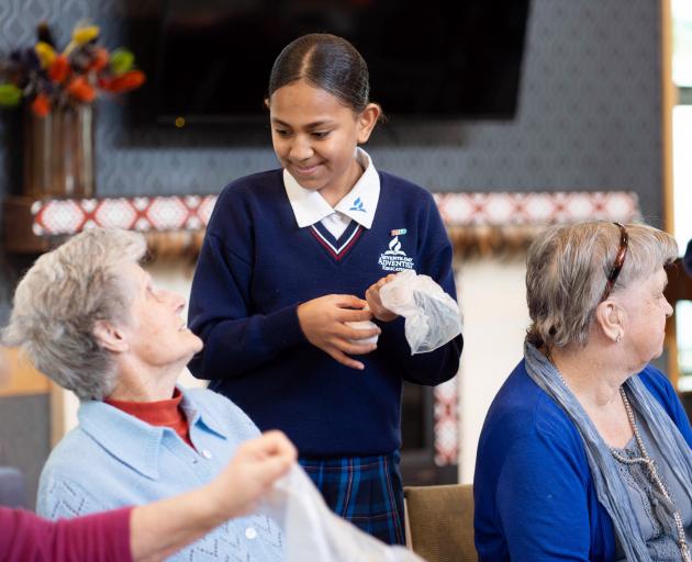 Southland Adventist Christian School pupil Vasemaca (Va) Tuivanuayelewa, 12, helps out Vickery...