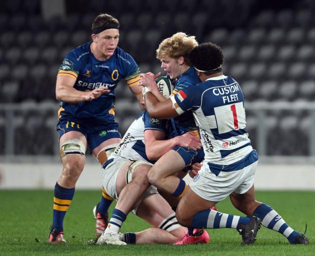 Otago’s Finn Hurley holds on tight as Auckland prop Joshua Fusitu’a tries to prise the ball from...