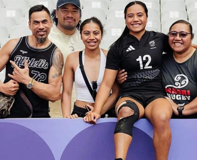 Black Ferns sevens player Alena Saili (second from right), of Southland, celebrates with her...