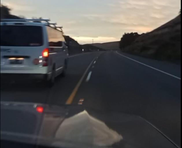 The driver passes a van on yellow lines during a high-speed pursuit from Oamaru to Waihola....