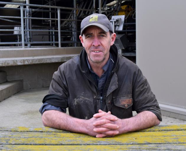 Profitable workplace. . .Dairy farmer Duncan Wells outside a 54-bail rotary shed on Huntly Road...